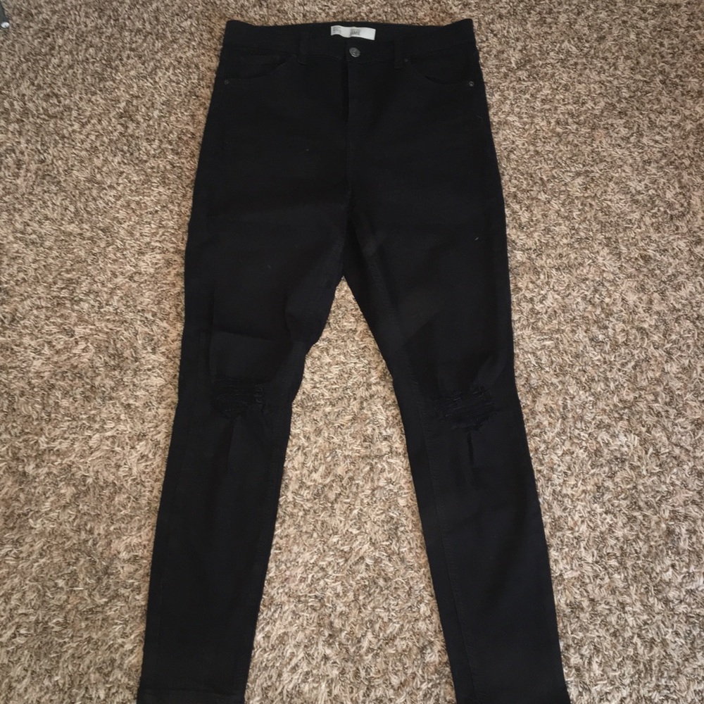 Black Skinnies with holes in the knees